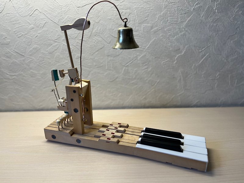 A table bell made of the keys and hammer of an old piano and an antique brass be - 其他家具 - 木头 咖啡色
